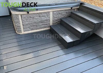 Tough Decking Anthracite Active + With Step Nose Boards On Side Of Hot Tub