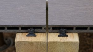 Composite decking expansion gaps at the board ends over a doubled joist