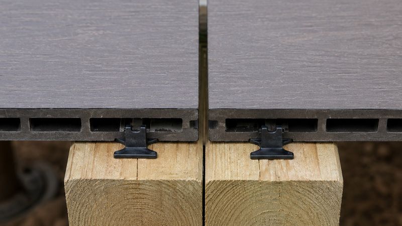 Composite decking expansion gaps at the board ends over a doubled joist